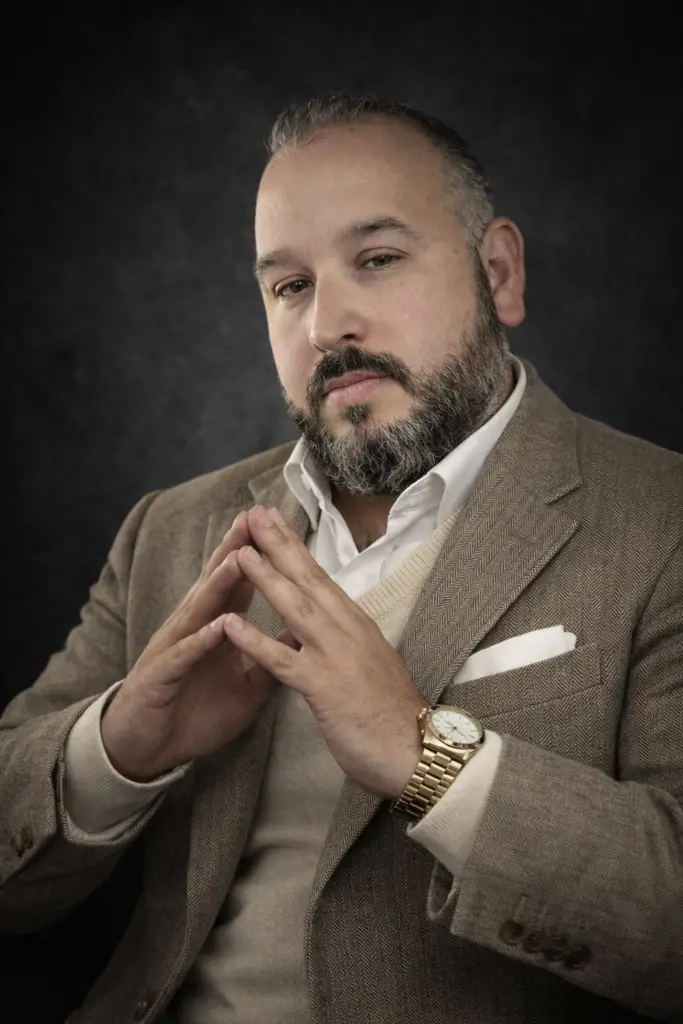 John Blissard, CEO and Founder of FIXIT FINANCIAL, in a professional suit portrait